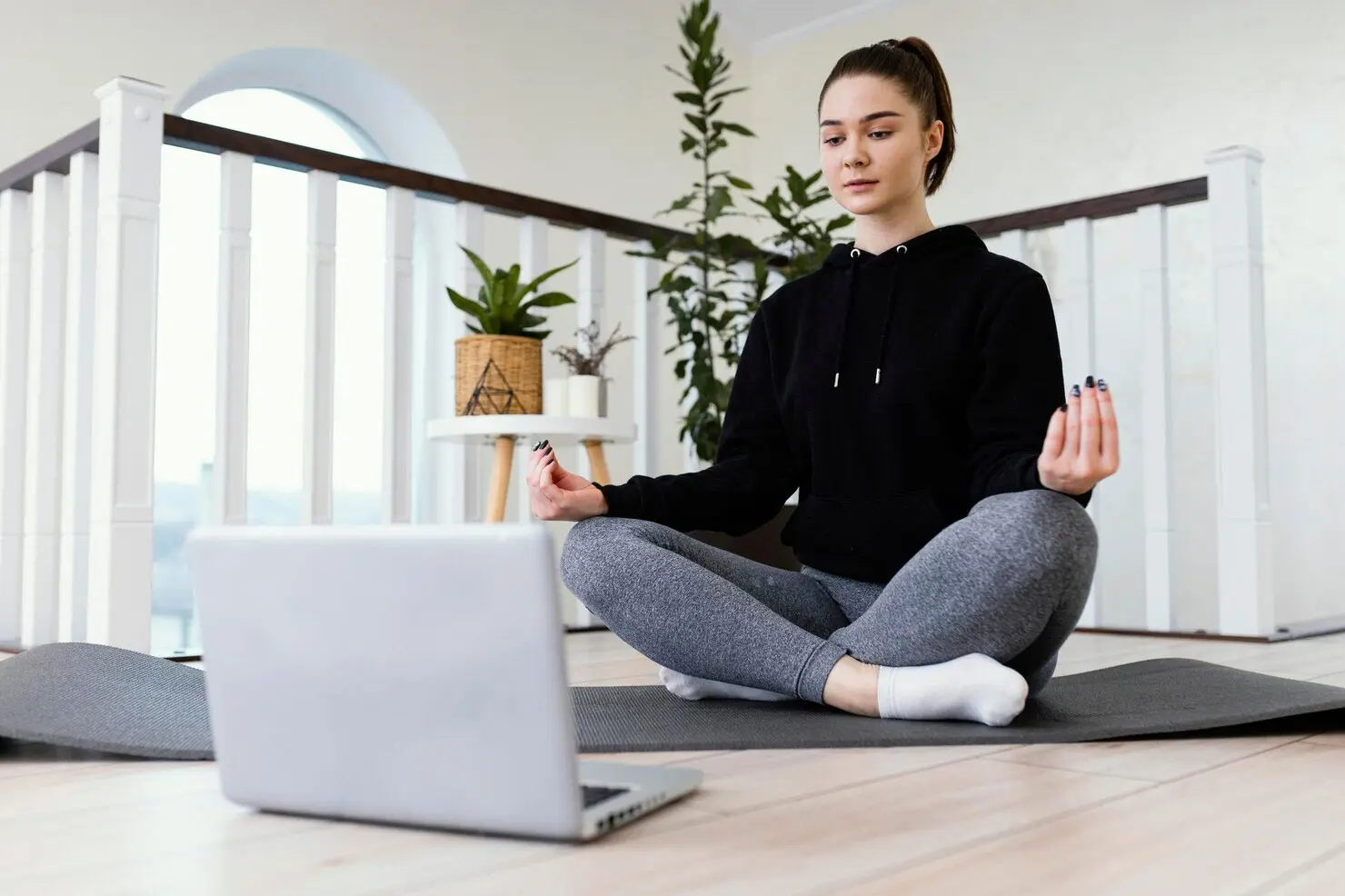 Live online yoga class with certified yoga teacher guiding students in real-time