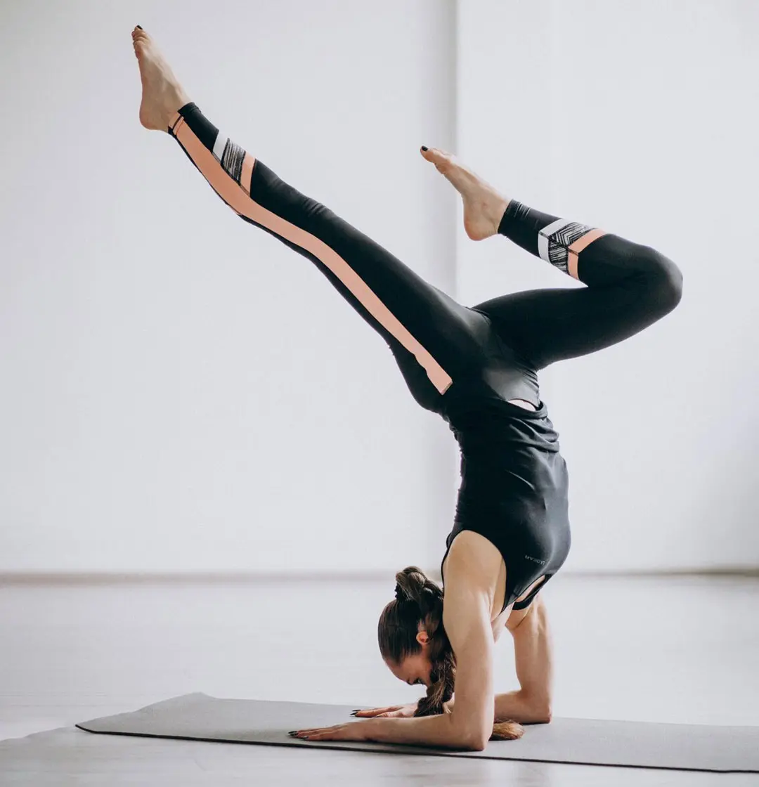 Beginner practicing live online yoga class with certified yoga instructor